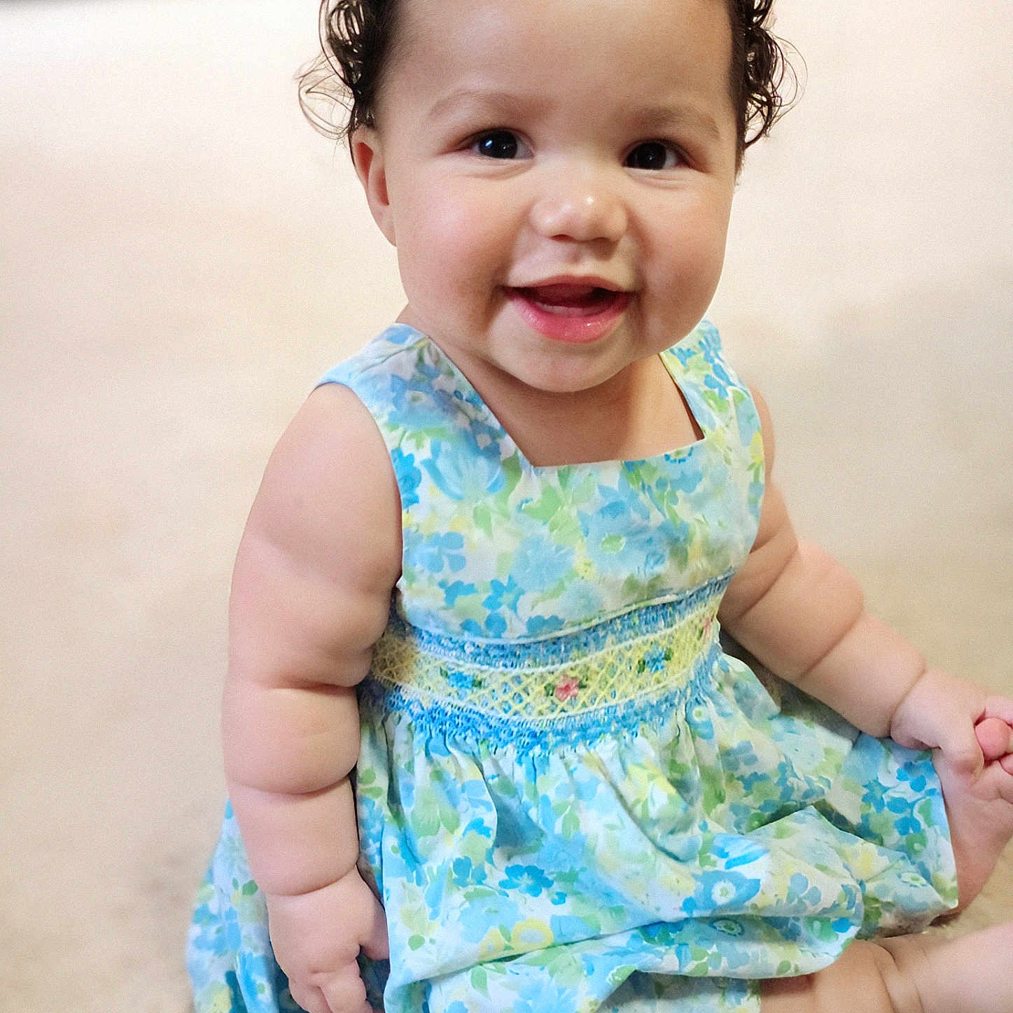 Adalee is registered to the contest to win money with this photo: baby, babylaughing, bodypart, clothing, dress, eveningdress, face, finger, formalwear, hand, happy, head, laughing, mouth, pattern, person, photography, portrait, sitting, smile