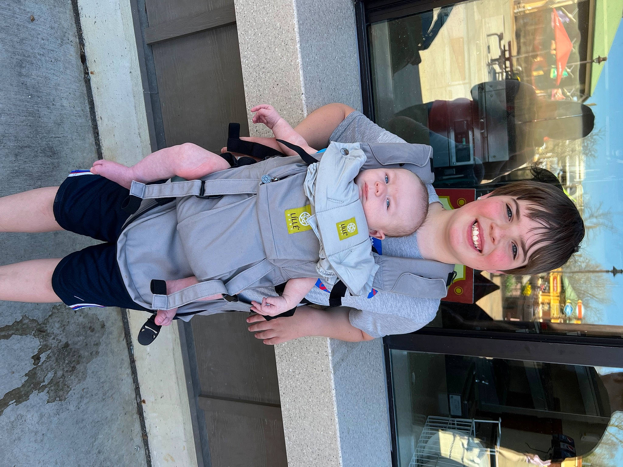 Thatcher is registered to the contest to win money with this photo: baby_toddler_clothing, child, electric_blue, fun, hat, human_leg, joy, outdoor_shoe, person, smile, toddler, vacation, walking_shoe