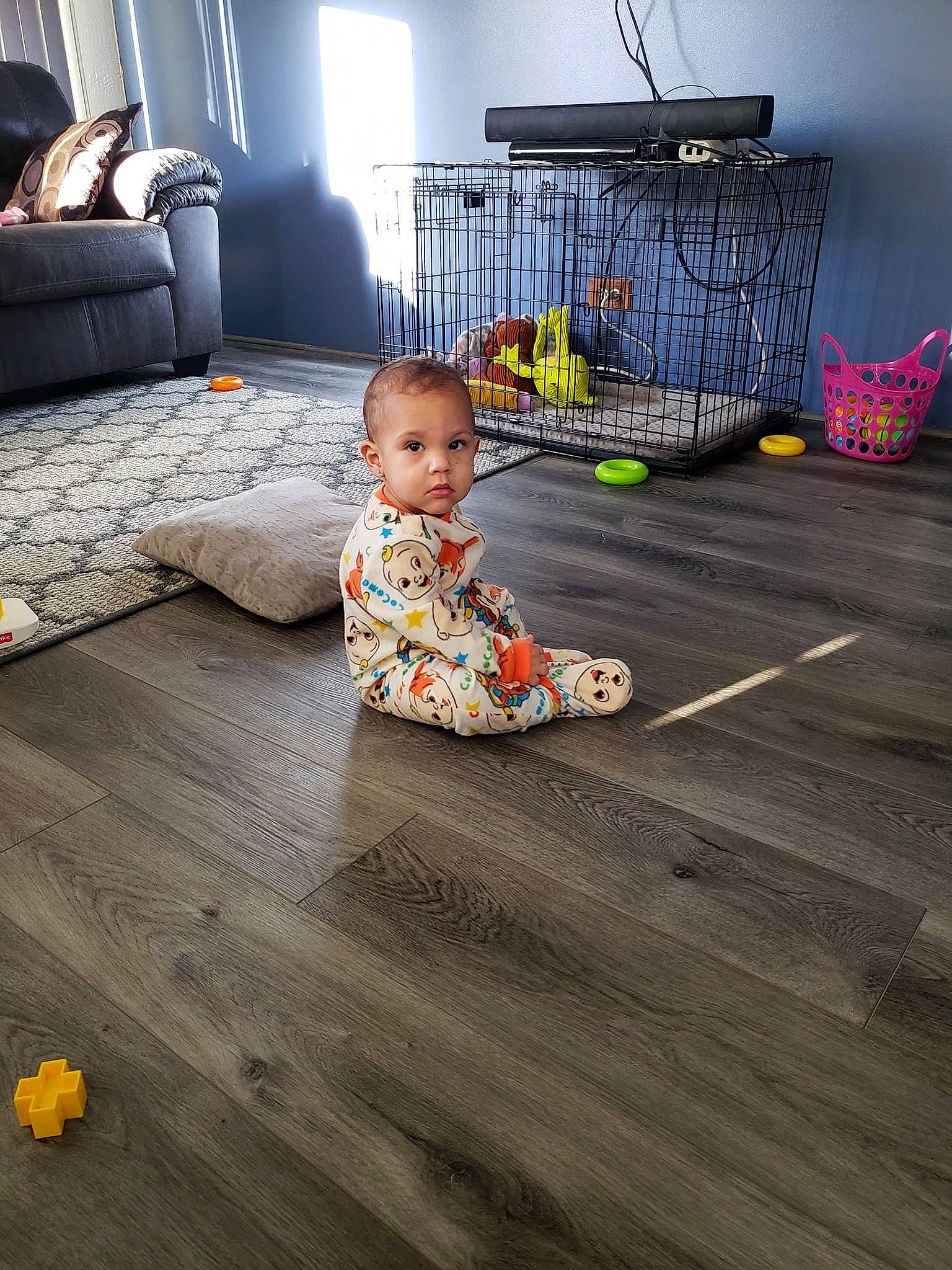 Bakari is registered to the contest to win money with this photo: baby, baby_products, baby_toddler_clothing, carpet, child, comfort, couch, floor, flooring, hardwood, home, house, laminate_flooring, living_room, pattern, person, room, toddler, wood, wood_flooring