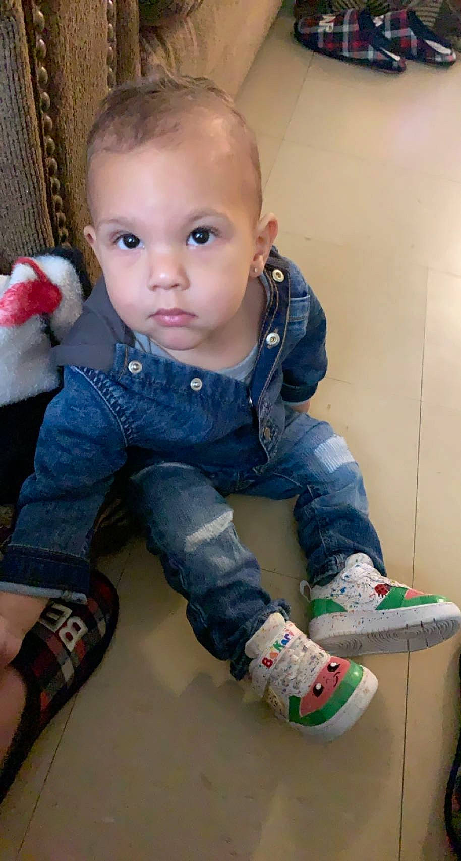 Bakari is registered to the contest to win money with this photo: baby, baby_toddler_clothing, cheek, child, electric_blue, eye, finger, flooring, fun, human_leg, joint, knee, pattern, person, pink, shoe, skin, sleeve, sock, toddler