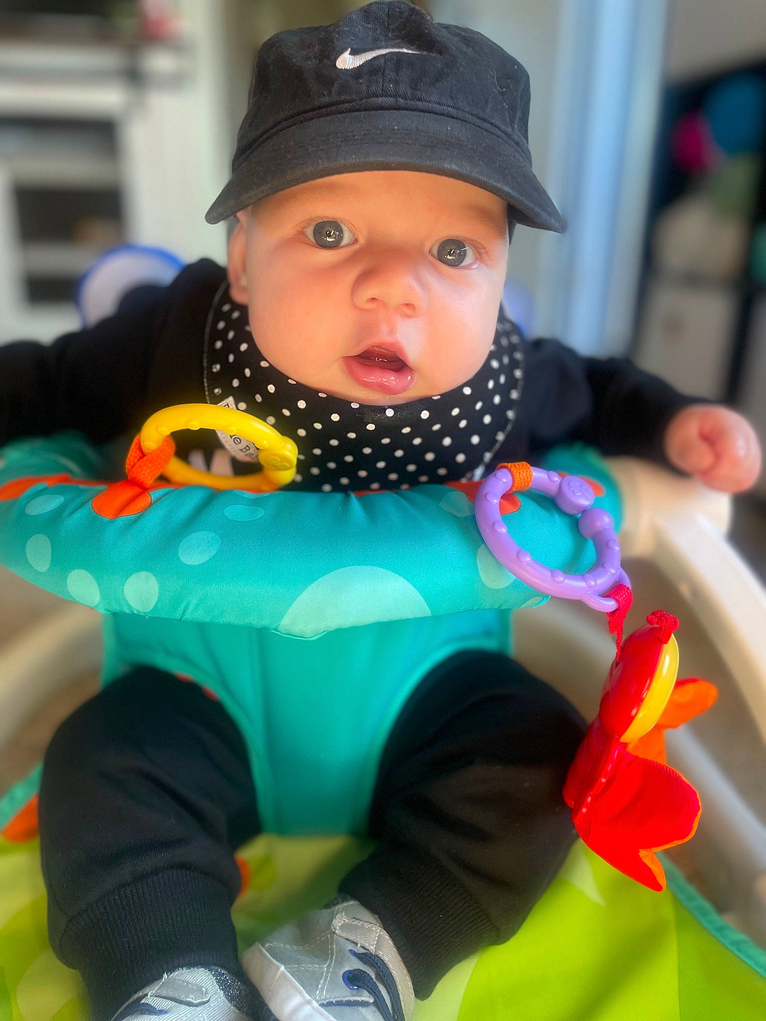 Luke joined the competition — help win amazing prizes! baby, baby_products, baby_toddler_clothing, beanie, cap, child, electric_blue, fashion_accessory, foot, fun, happy, headgear, headwear, pattern, person, personal_protective_equipment, pink, play, product, sitting