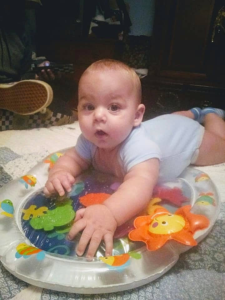 Dalton is registered to the contest to win money with this photo: baby, baby_products, baby_toys, child, comfort_food, eating, food, fun, person, play, product, sitting, surprise, sweetness, toddler, tummy_time