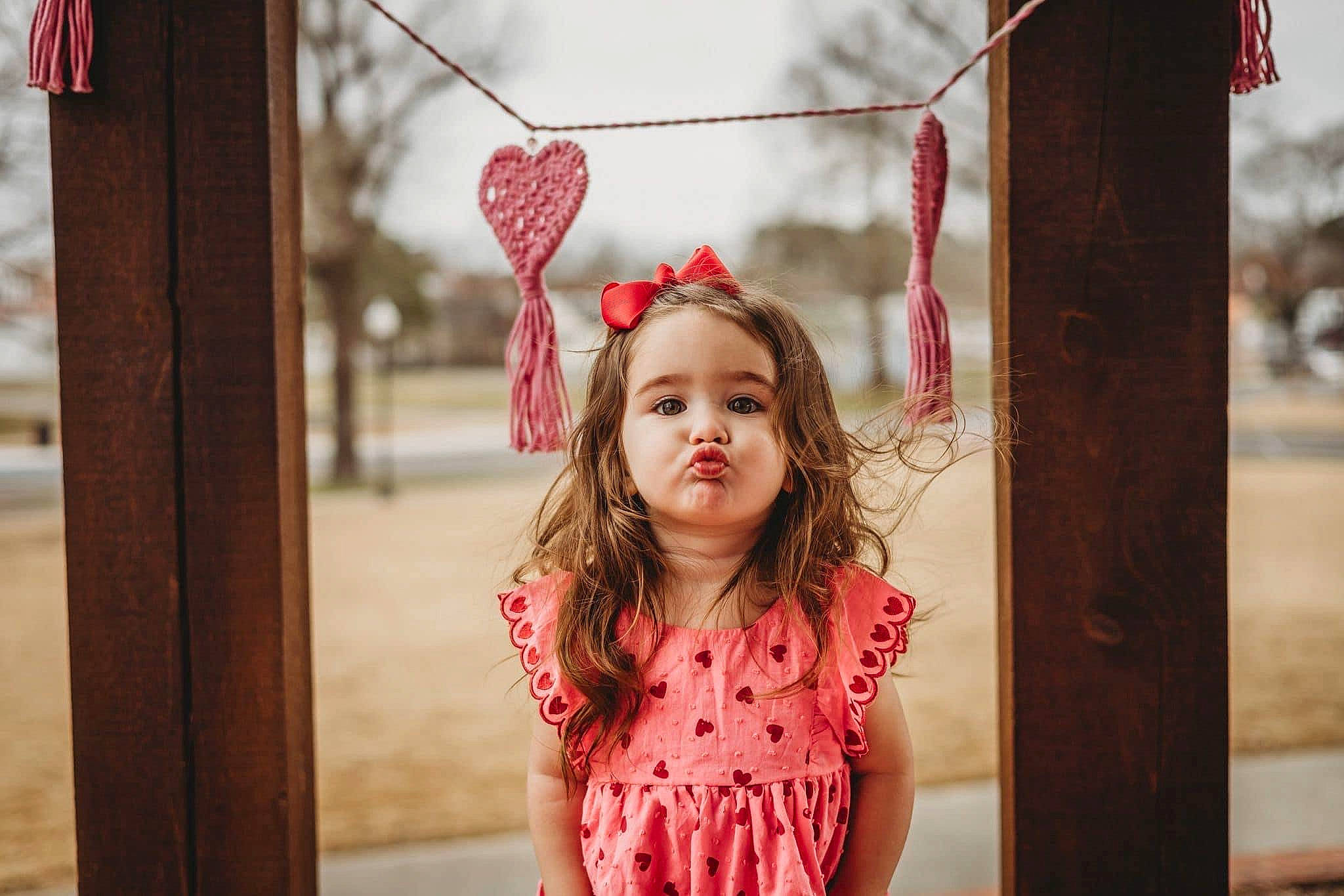 River joined the competition — help win amazing prizes! brown_hair, child, city, eye, fashion_accessory, fun, grass, happy, head, leisure, lip, magenta, pattern, person, pink, recreation, red, spring, standing, toddler