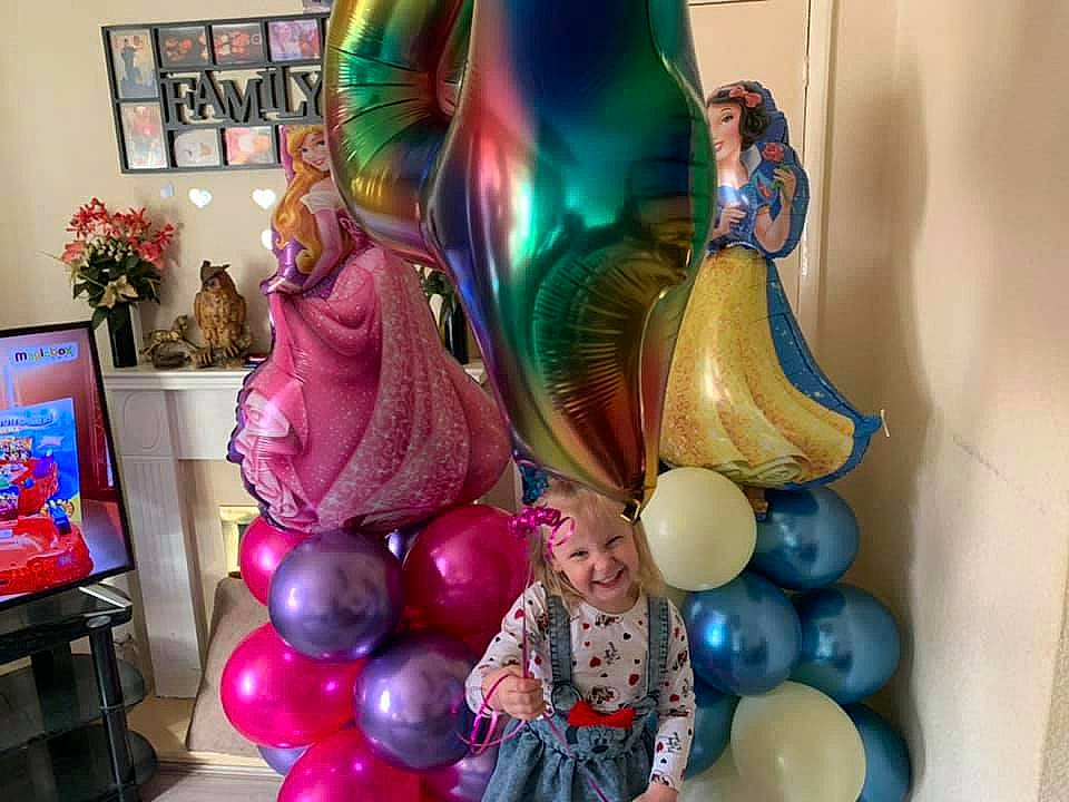 Layla-mae is registered to the contest to win money with this photo: art, balloon, christmas_decoration, event, flowerpot, fun, headwear, houseplant, interior_design, joy, lamp, magenta, ornament, party_supply, person, picture_frame, pink, plant, purple, television