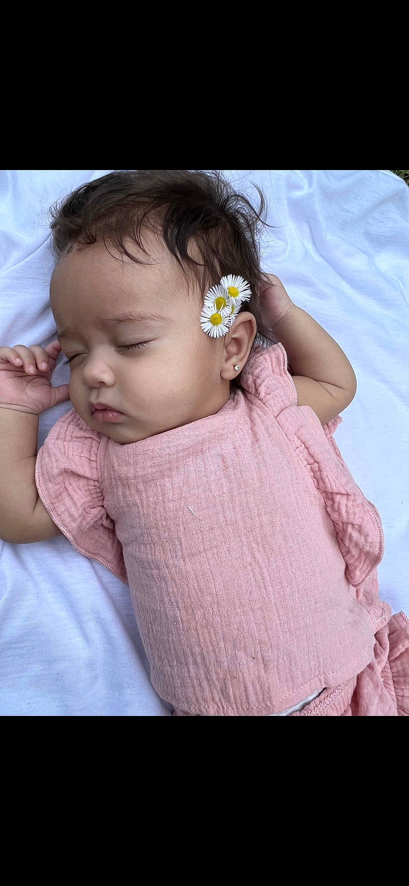 Alayah is registered to the contest to win money with this photo: baby, baby_products, baby_toddler_clothing, cheek, dress, eyelash, finger, flower, happy, headband, headpiece, iris, lip, neck, person, petal, pink, skin, sleeve, textile