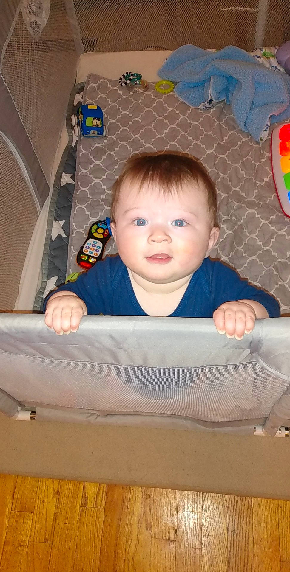 River is registered to the contest to win money with this photo: baby, baby_products, baby_safety, baby_toddler_clothing, baby_toys, cheek, child, comfort, flooring, fun, hardwood, infant_bed, linens, person, product, room, sitting, skin, t_shirt, toddler