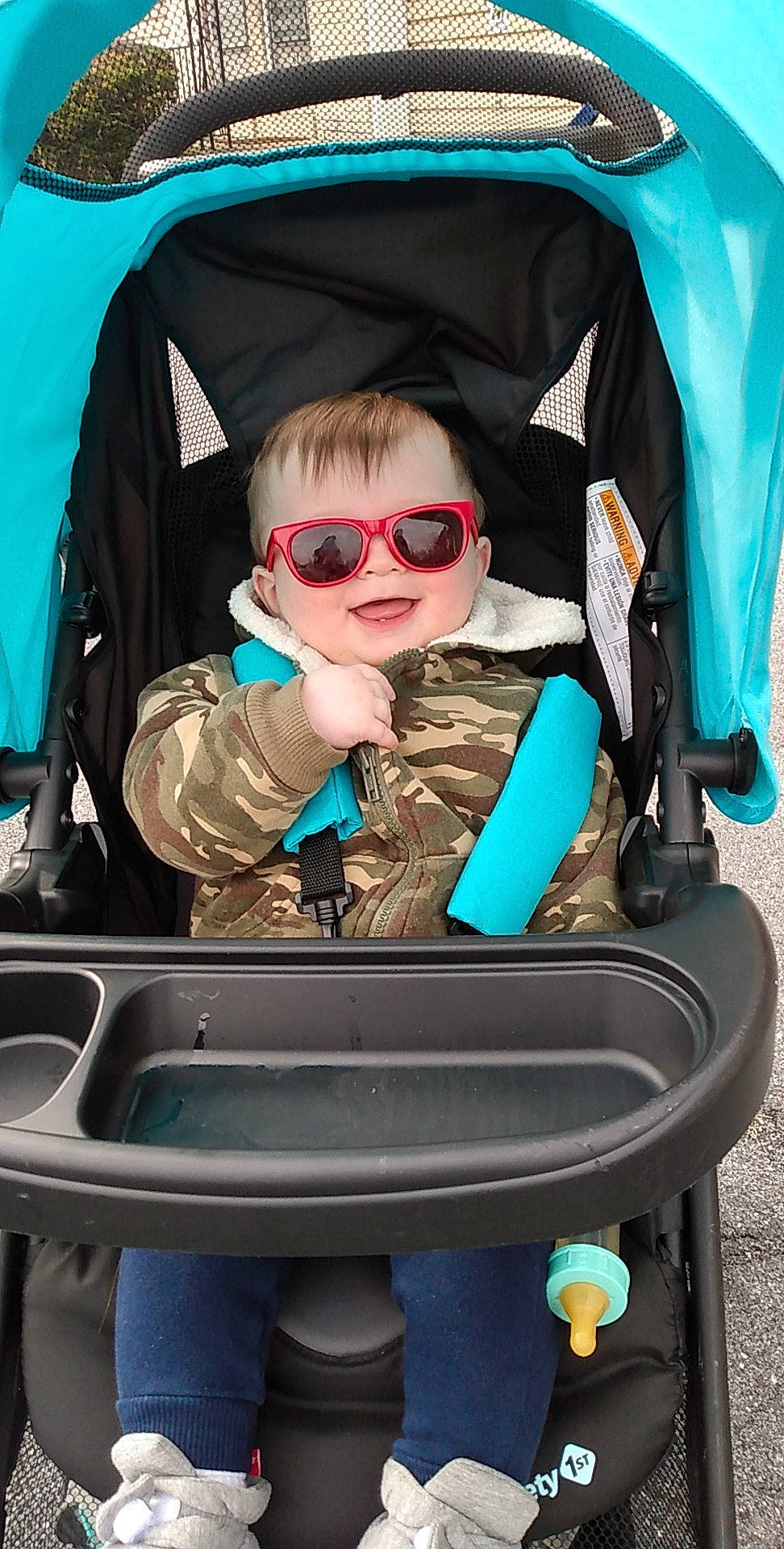 River is registered to the contest to win money with this photo: baby_carriage, baby_products, beauty, blue, car_seat, child, comfort, electric_blue, eyewear, fun, glasses, goggles, green, leisure, person, personal_protective_equipment, recreation, smile, sunglasses, toddler
