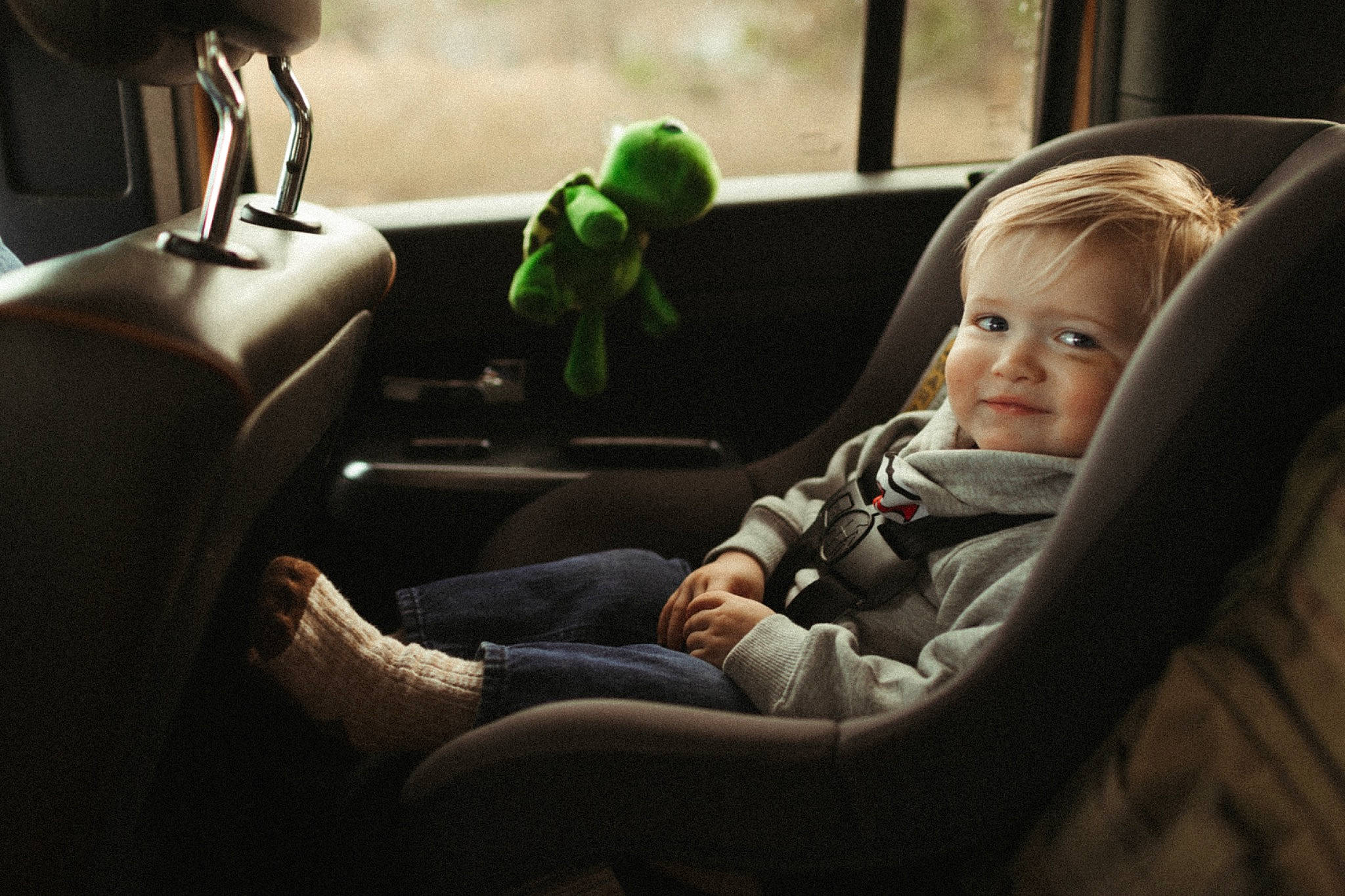 Aksel is registered to the contest to win money with this photo: auto_part, automotive_design, automotive_exterior, baby, car, car_seat, child, comfort, fun, head, joy, mode_of_transport, motor_vehicle, passenger, person, personal_luxury_car, steering_wheel, toddler, toy, vehicle