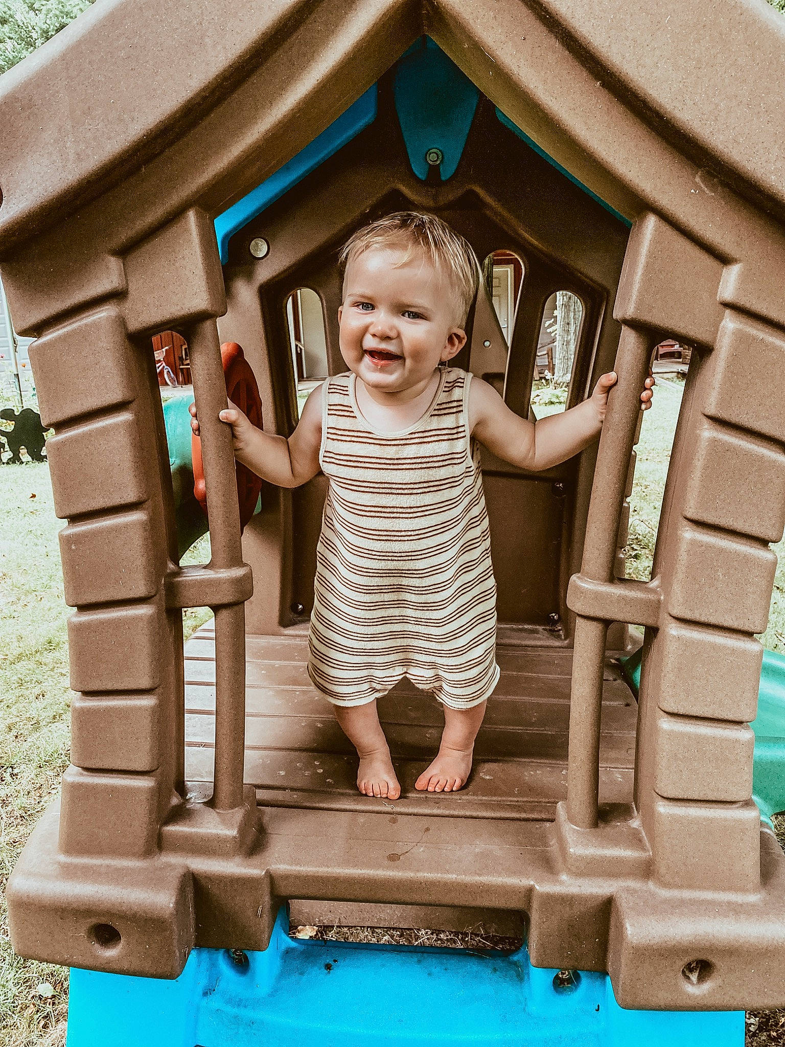 Aksel joined the competition — help win amazing prizes! baby_toddler_clothing, blue, child, eye, fun, happy, head, house, joy, leisure, outdoor_furniture, outdoor_play_equipment, person, photograph, pink, public_space, recreation, smile, standing, t_shirt