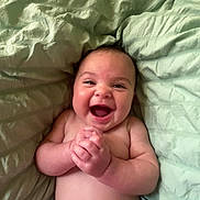 Maielynn joined the competition — help win amazing prizes! baby, smiling, diaper, hands, face, skin, lying_down, blanket, infant, joyful, cute, child, happy, expression, closeup, human, portrait, newborn, indoors, soft