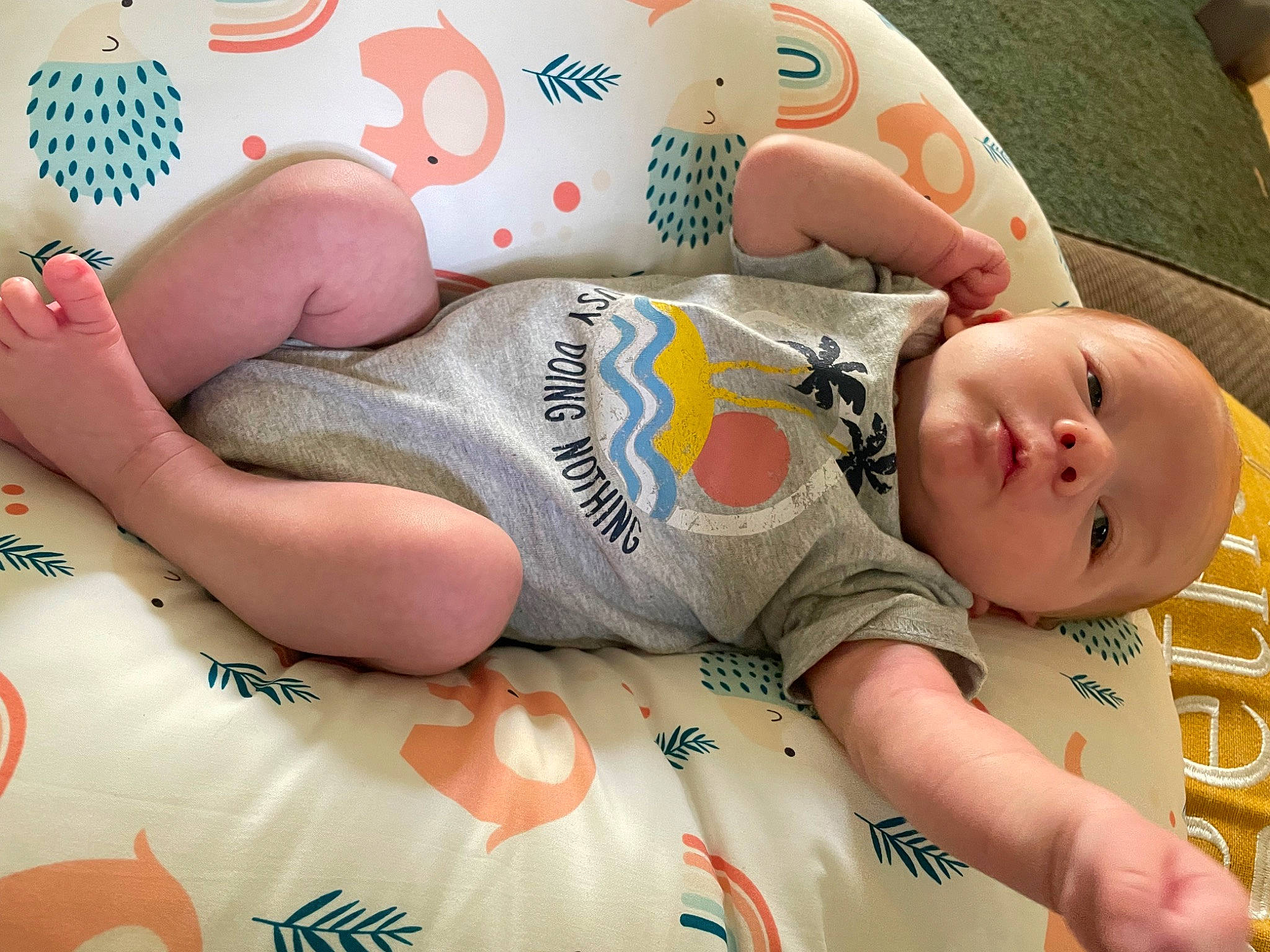 Dwayne is registered to the contest to win money with this photo: aluminum_can, baby, baby_toddler_clothing, chest, child, comfort, drinkware, elbow, facial_expression, finger, foot, happy, human_leg, nail, pattern, person, skin, sleeve, thigh, toddler