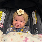 Ava is registered to the contest to win money with this photo: baby, bed, cap, clothing, crib, cushion, face, furniture, glove, happy, hat, head, homedecor, infantbed, newborn, person, photography, portrait, sleeping, smile
