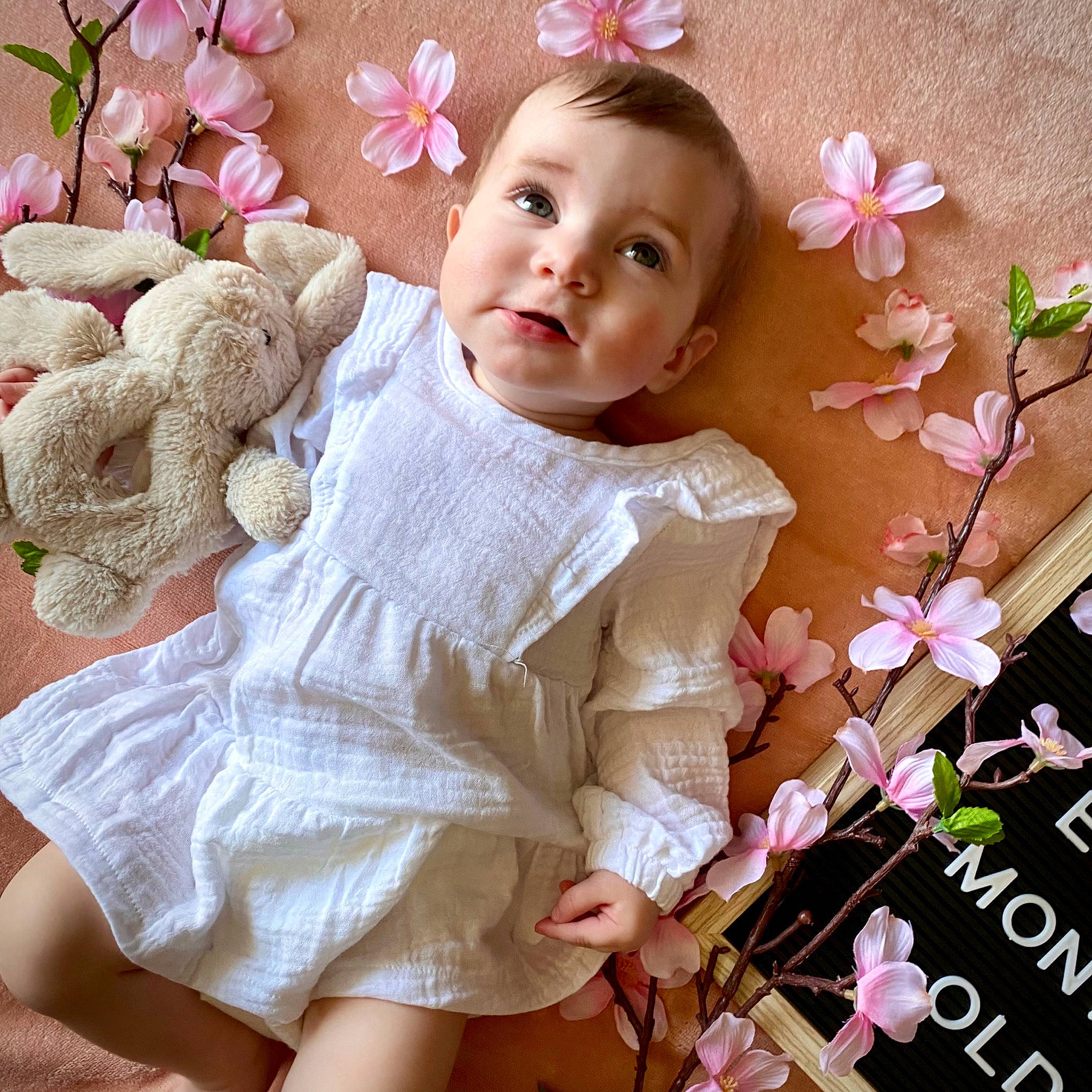 Arabelle joined the competition — help win amazing prizes! arm, baby_toddler_clothing, beauty, blond, child, cut_flowers, flower, hairstyle, hand, happy, magenta, pattern, person, petal, pink, plant, skin, sleeve, textile, thigh