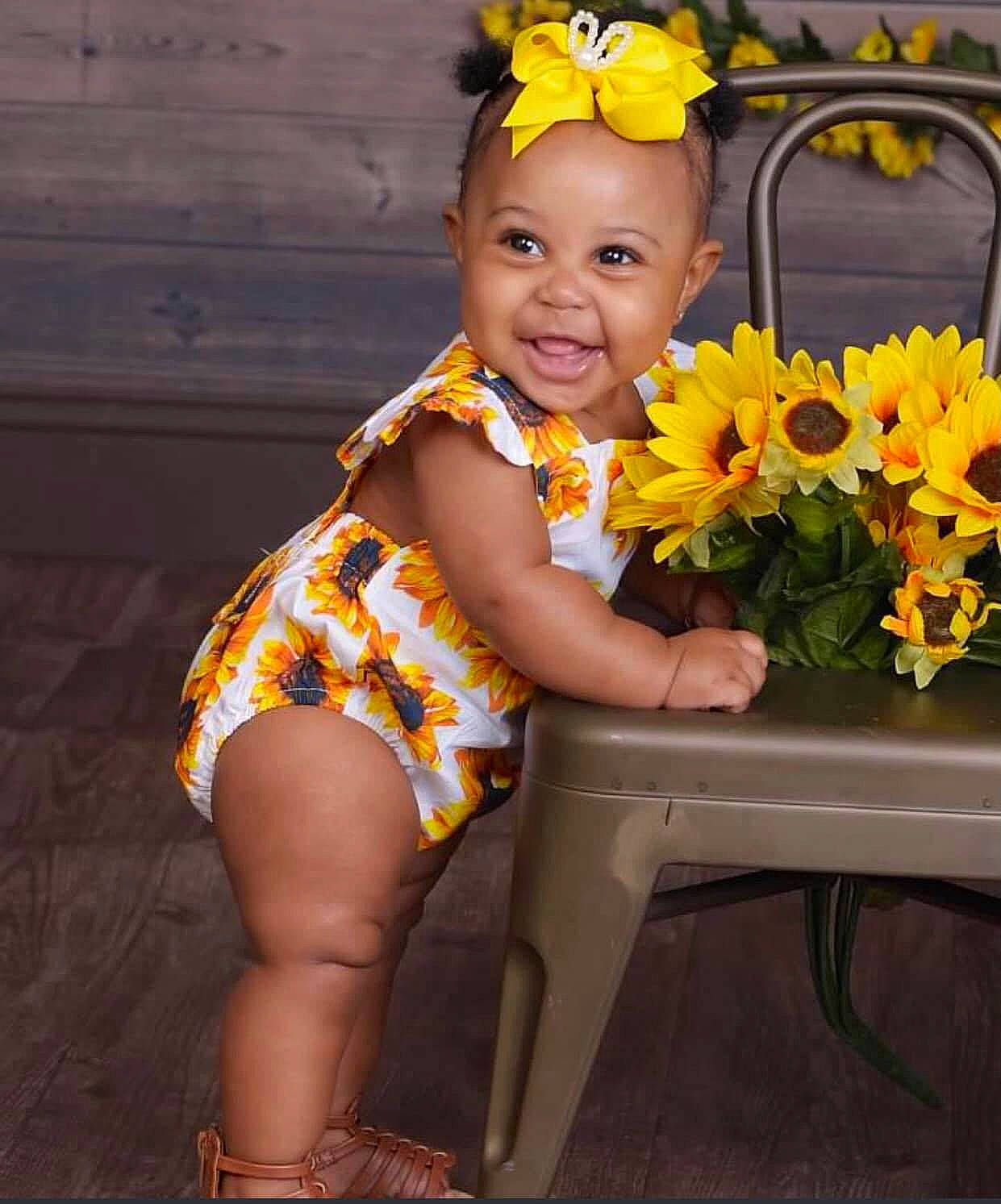 Calani joined the competition — help win amazing prizes! child, child_model, flower, happy, joy, person, plant, sitting, smile, sunflower, thigh, toddler, yellow