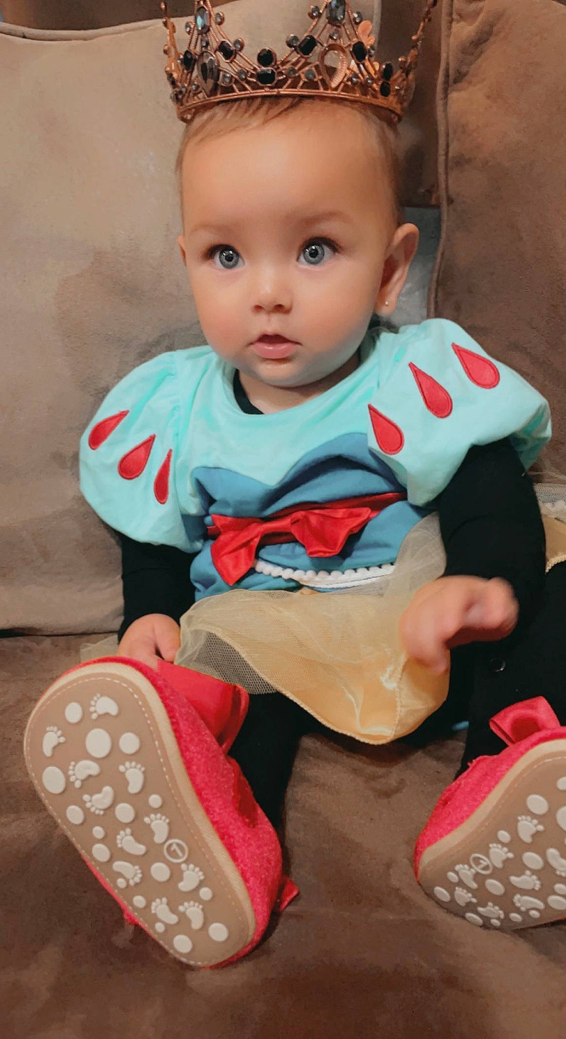 Laina is registered to the contest to win money with this photo: arm, baby, baby_toddler_clothing, carmine, cheek, child, eye, face, fun, hairstyle, happy, pattern, person, pink, play, sitting, skin, sleeve, sock, t_shirt