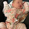 Nevaeh joined the competition — help win amazing prizes! baby, infant, sleeping, portrait, floral_outfit, pink_clothing, onesie, car_seat, harness, blanket, cushion, indoor, cozy, peaceful, closed_eyes, face, arms_raised, legs, sitting, photography