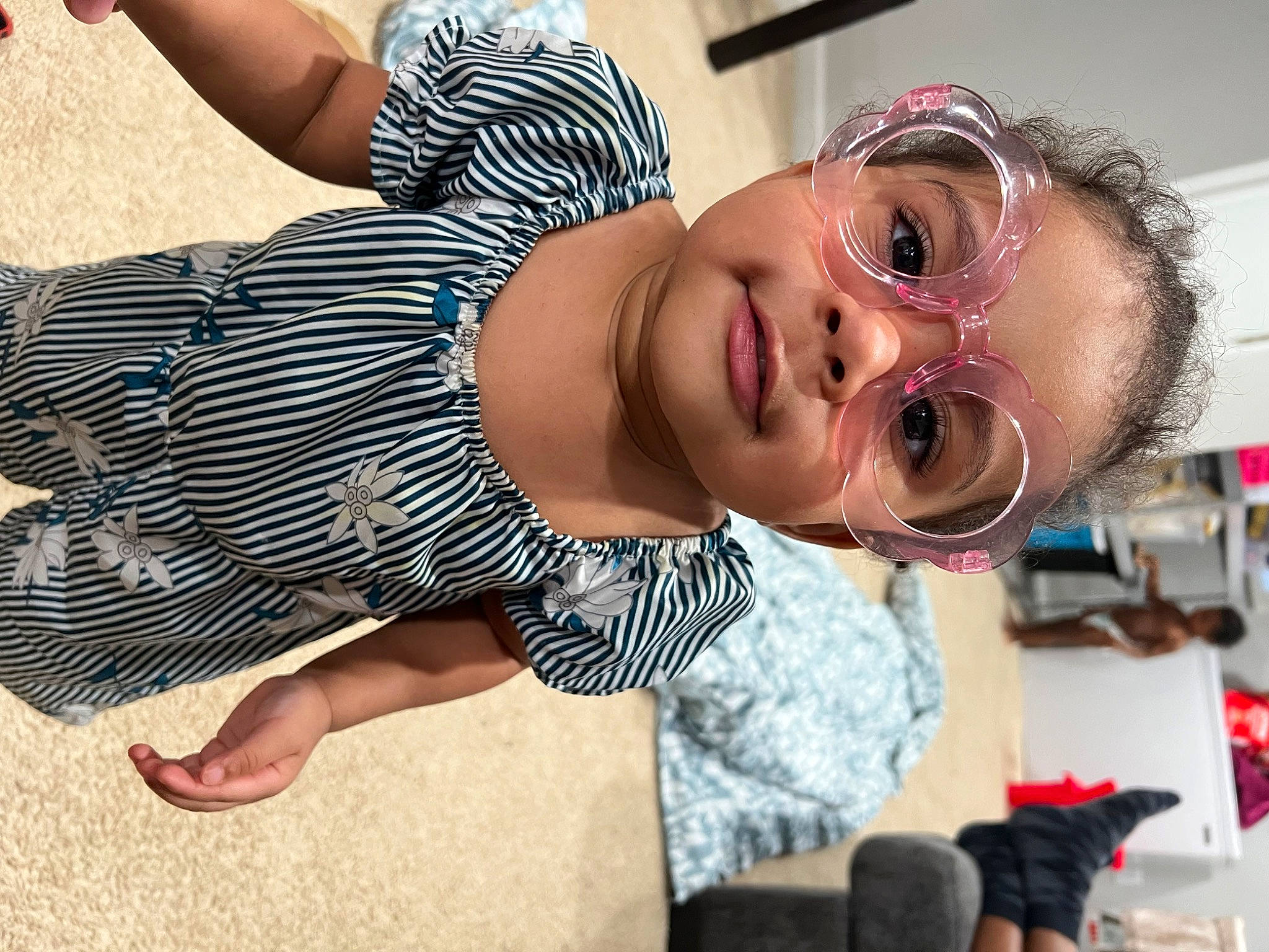 Kayla is registered to the contest to win money with this photo: camera, chest, child, eyelash, eyewear, fashion_accessory, fun, happy, human_leg, lip, neck, pattern, person, portrait_photography, single_lens_reflex_camera, smile, thigh, toddler, vacation, video_camera