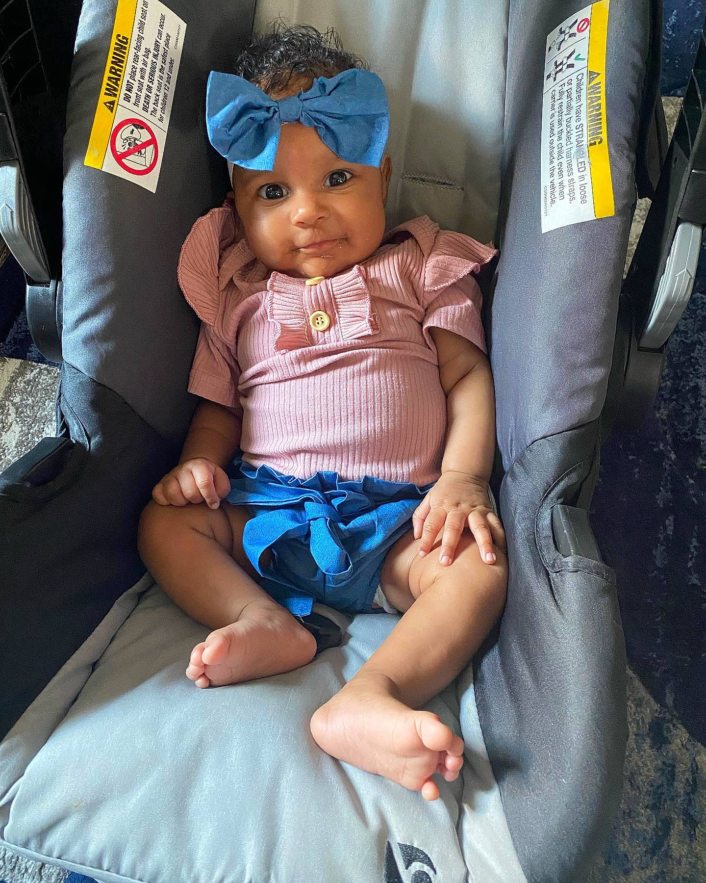 Leiloni joined the competition — help win amazing prizes! auto_part, baby, baby_products, bag, baseball_cap, cap, car_seat, child, comfort, doll, electric_blue, eyewear, fashion_accessory, hat, headwear, human_leg, lap, person, sitting, sun_hat
