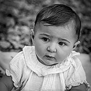 Mia a rejoint le concours — aidez-le/la à gagner de superbes lots ! baby, child, portrait, black_and_white, outdoor, curious, white_clothing, blanket, soft_focus, cute, face, hand, sitting, young, expression, innocence, natural_light, photography, closeup, infant