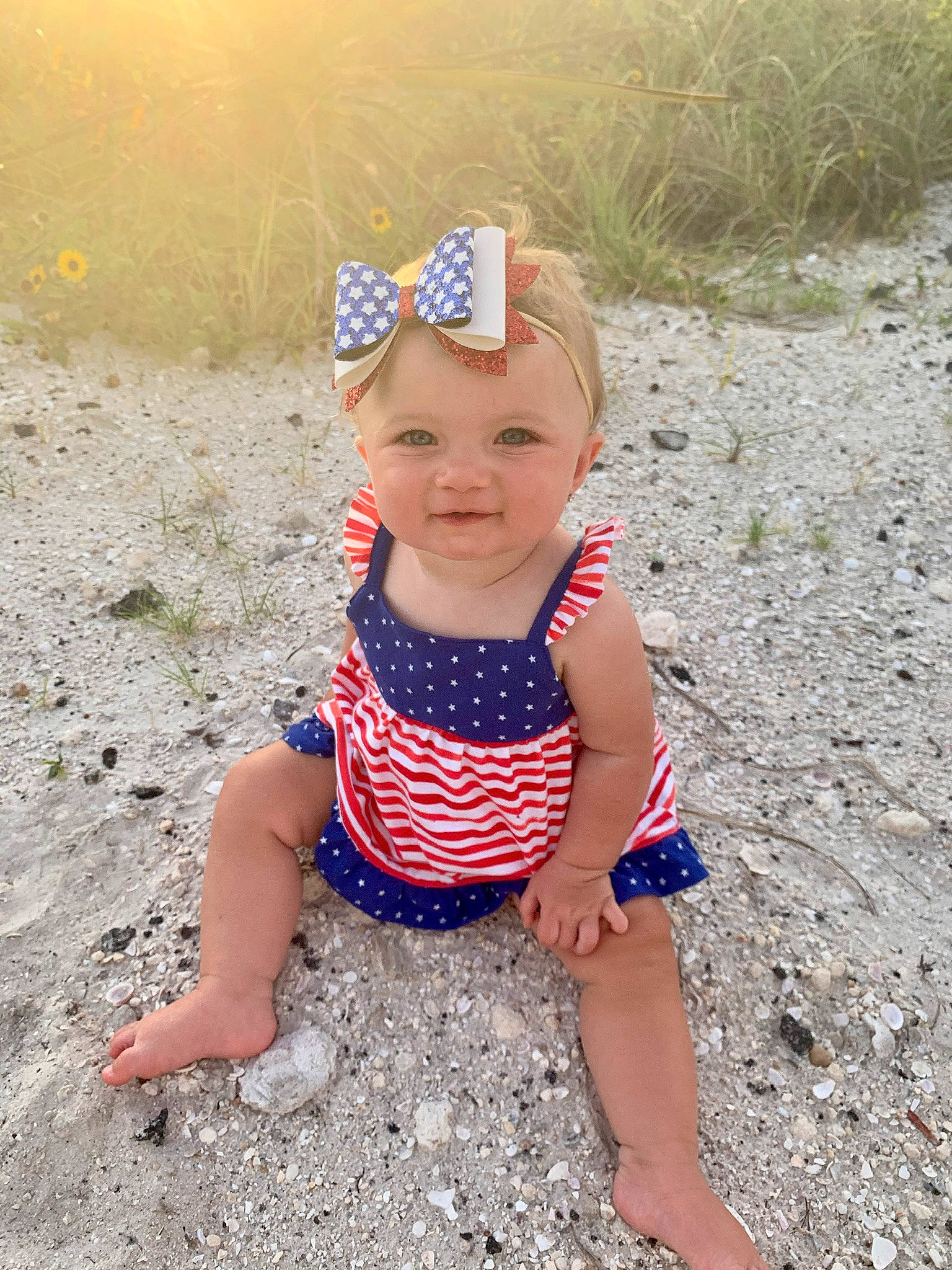 Gracie Mae is registered to the contest to win money with this photo: baby, baby_toddler_clothing, child, design, fashion_accessory, fawn, fun, hair_accessory, headband, headgear, joy, pattern, person, play, polka_dot, sand, smile, soil, summer, toddler