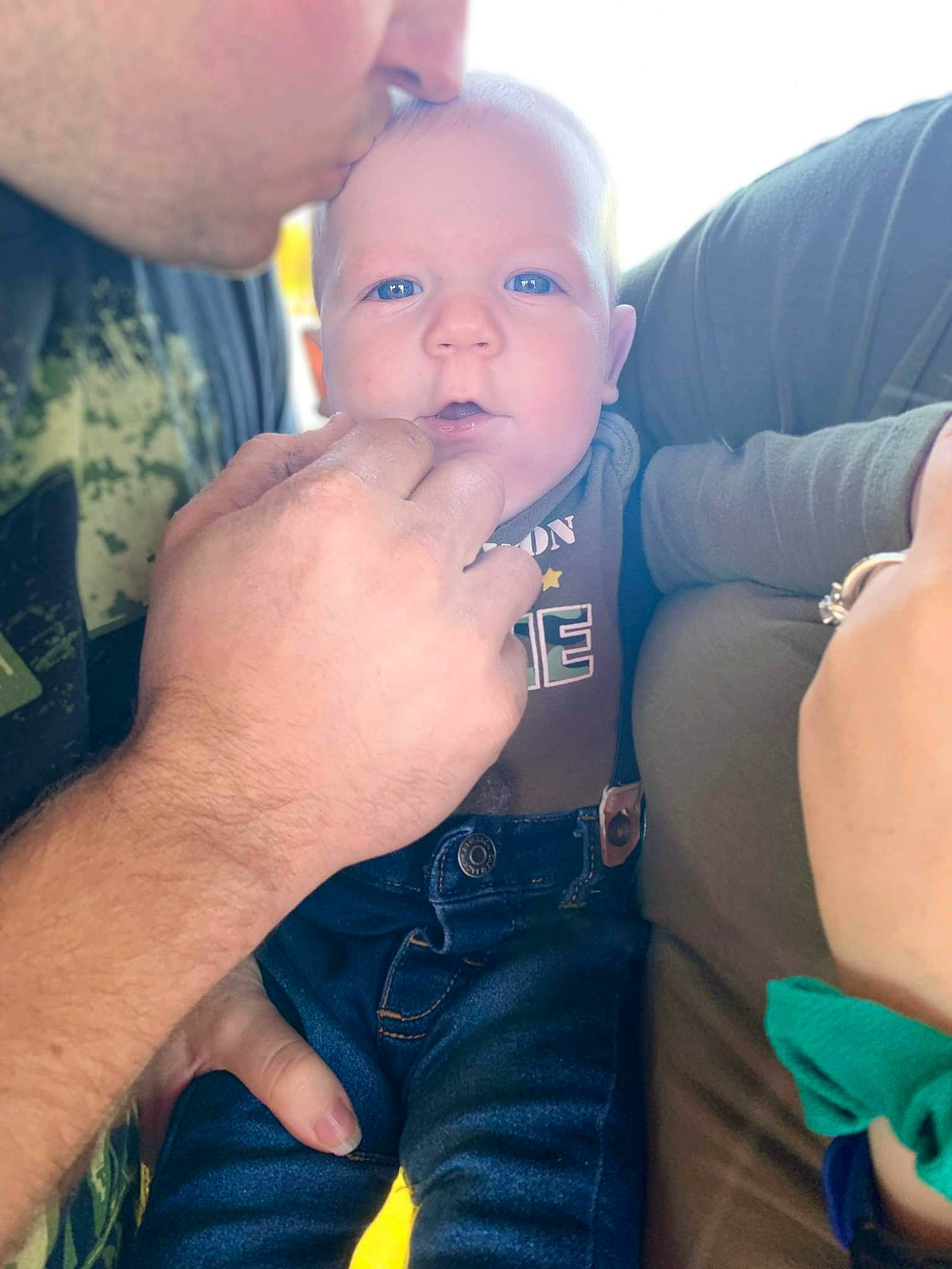 Cowen is registered to the contest to win money with this photo: arm, azure, baby, blue, cloud, eye, face, finger, gesture, hand, happy, head, iris, leg, mouth, muscle, neck, nose, person, skin