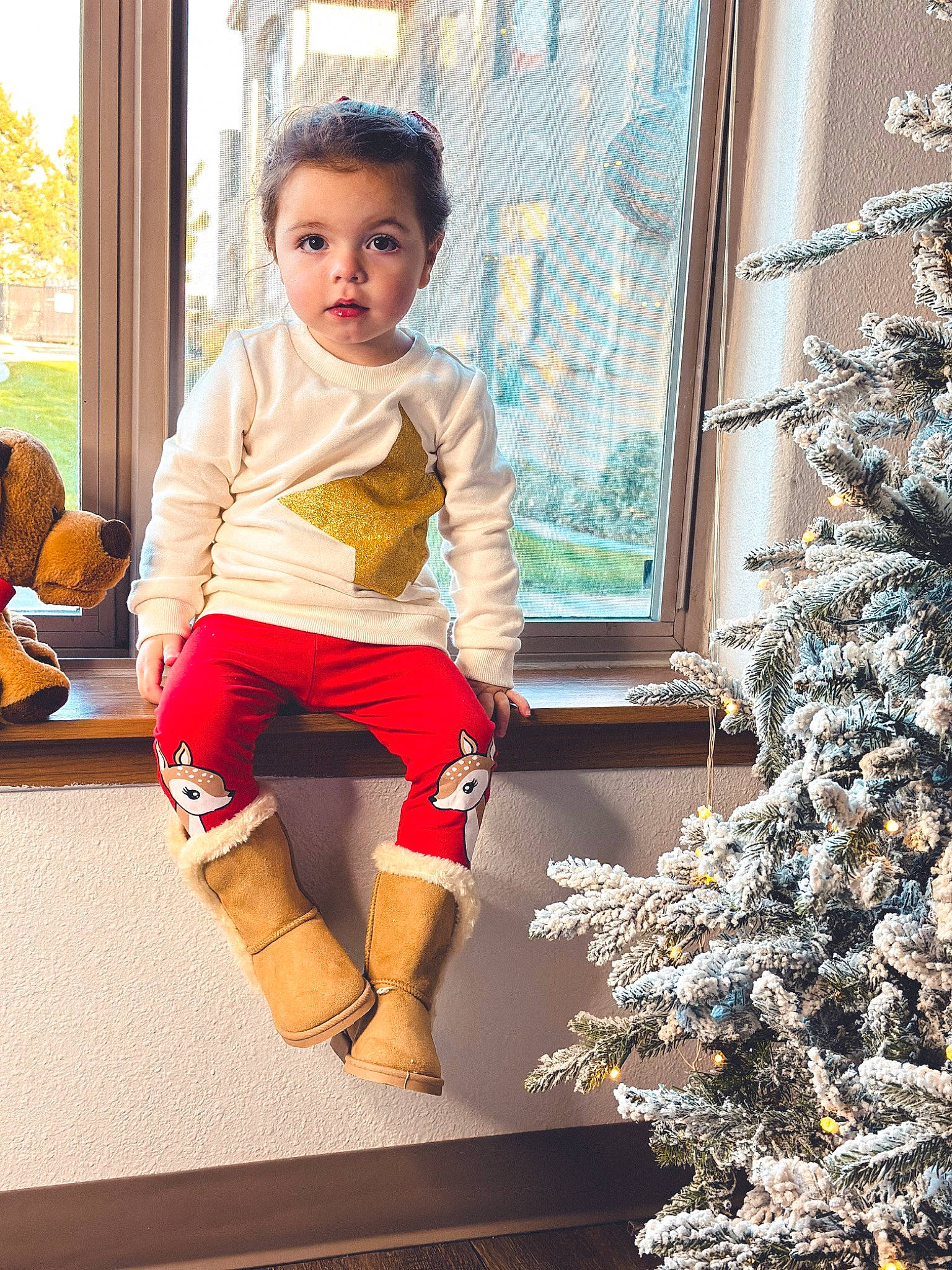 Mariana joined the competition — help win amazing prizes! child, christmas_decoration, christmas_ornament, christmas_tree, event, fashion, fun, happy, holiday_ornament, human_leg, knee, leisure, ornament, person, shorts, sitting, standing, t_shirt, thigh, toddler