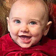 Joy participe au concours pour gagner de l'argent avec cette photo : baby, child, smile, happy, face, portrait, red_dress, cute, young, infant, closeup, eyes, cheeks, tongue, laughing, clothing, human, skin, head, expression