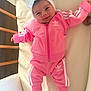 Sharell participe au concours pour gagner de l'argent avec cette photo : adidas, baby, blanket, child, clothing, cute, footwear, happy, headband, indoor, infant, lying_down, person, pink_tracksuit, portrait, smile, socks, soft_lighting, white_bow, wooden_crib