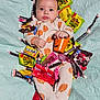 Goldie joined the competition — help win amazing prizes! baby, infant, pajamas, pumpkin_pattern, candy, halloween, tootsie_roll, dots_candy, sour_patch_kids, m&m, twizzlers, orange_bucket, blanket, quilted, lying_down, cute, child, holiday, festive, person