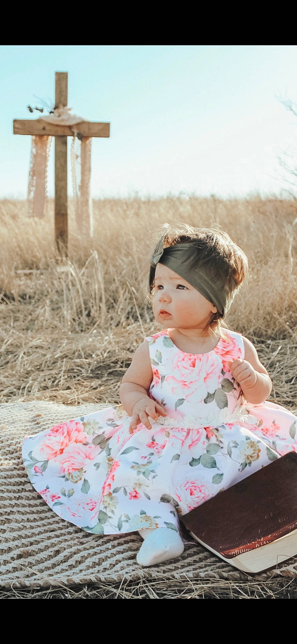 Chandler is registered to the contest to win money with this photo: baby, baby_toddler_clothing, child, dress, fashion_accessory, flash_photography, fun, grass, grass_family, grassland, happy, headwear, magenta, pattern, person, pink, sitting, skin, sky, sleeve
