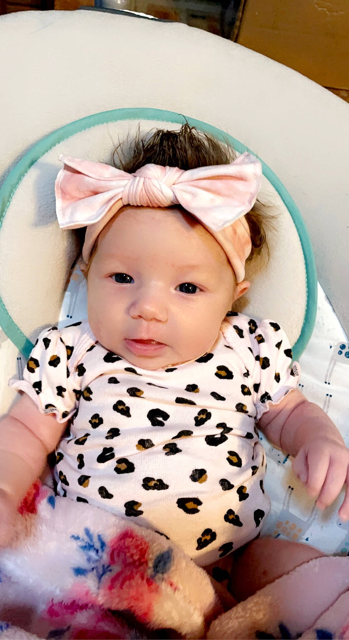 Chandler is registered to the contest to win money with this photo: baby, baby_products, baby_toddler_clothing, cheek, child, chin, collar, dress, eye, eyelash, happy, head, headwear, iris, linens, pattern, person, pink, skin, sleeve