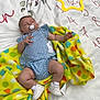 Adalynn is registered to the contest to win money with this photo: baby, blanket, clothing, cushion, face, flower, footwear, furniture, grass, head, homedecor, newborn, person, petal, photography, plant, portrait, quilt, rose, shoe