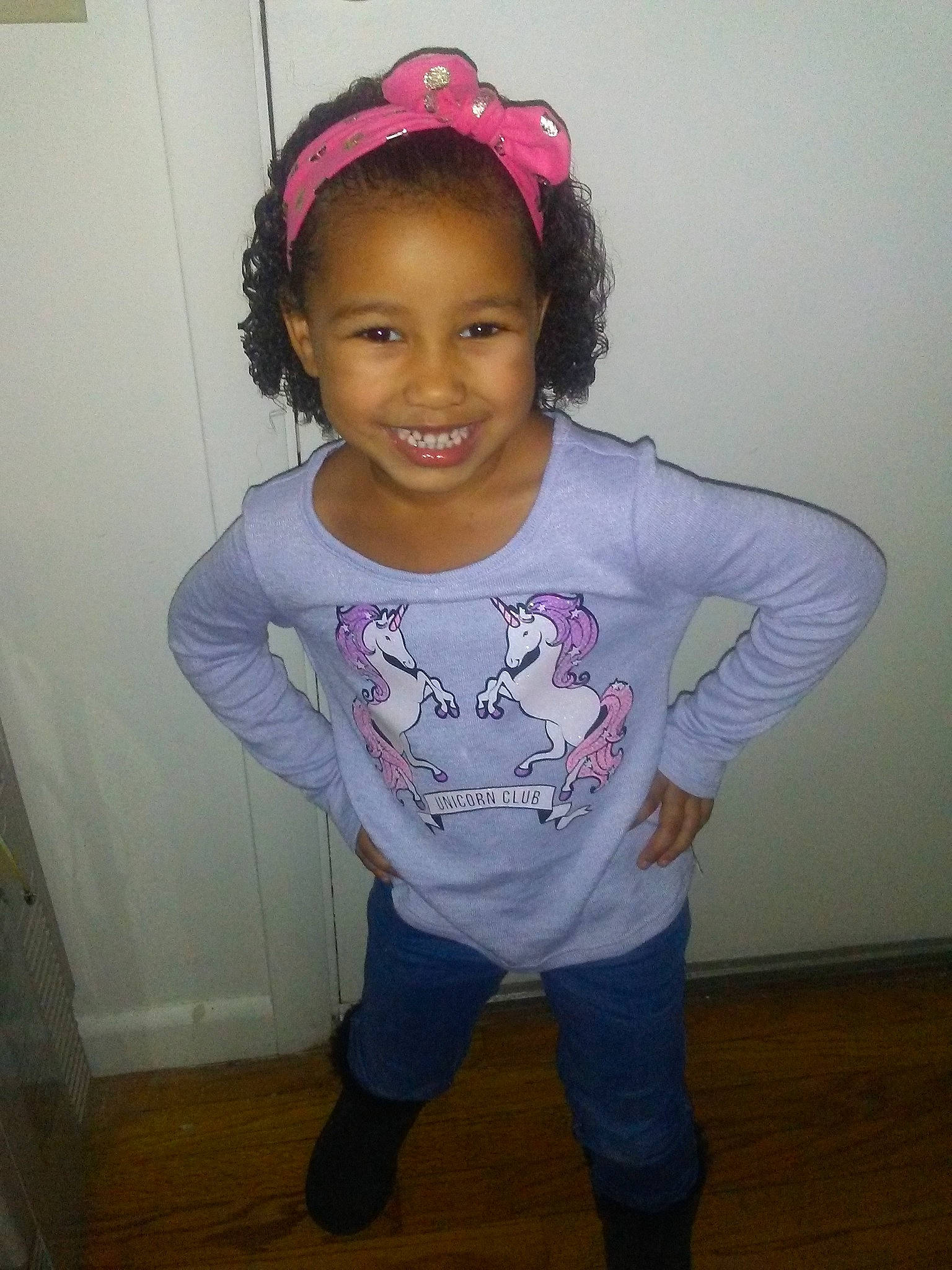 Aaliyah is registered to the contest to win money with this photo: child, clothing, day, fashion_accessory, fun, girl, hair, hair_accessory, hairstyle, head, headgear, joy, person, pink, product, purple, shoulder, skin, standing, t_shirt