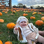 Aslan is registered to the contest to win money with this photo: autumn, baby, child, cute, fall, field, grass, greenery, happy, hat, infant, jacket, nature, outdoor, pacifier, person, pumpkin, pumpkin_patch, seasonal, smiling