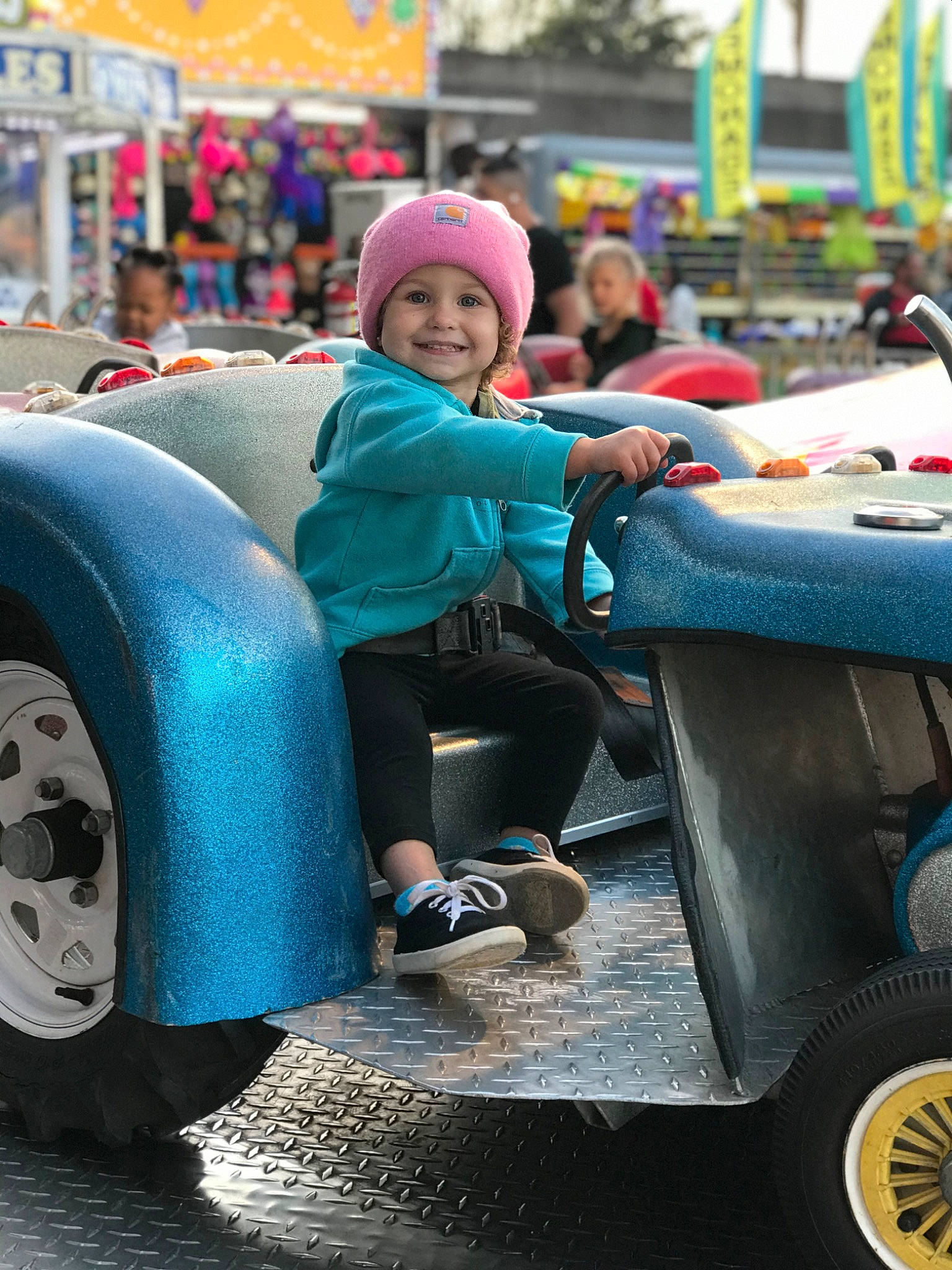 Emerlyn is registered to the contest to win money with this photo: auto_part, automotive_design, automotive_exterior, automotive_tire, automotive_wheel_system, blurred, bumper, electric_blue, fun, headwear, helmet, jacket, joy, leisure, mode_of_transport, motor_vehicle, people, person, smile, synthetic_rubber