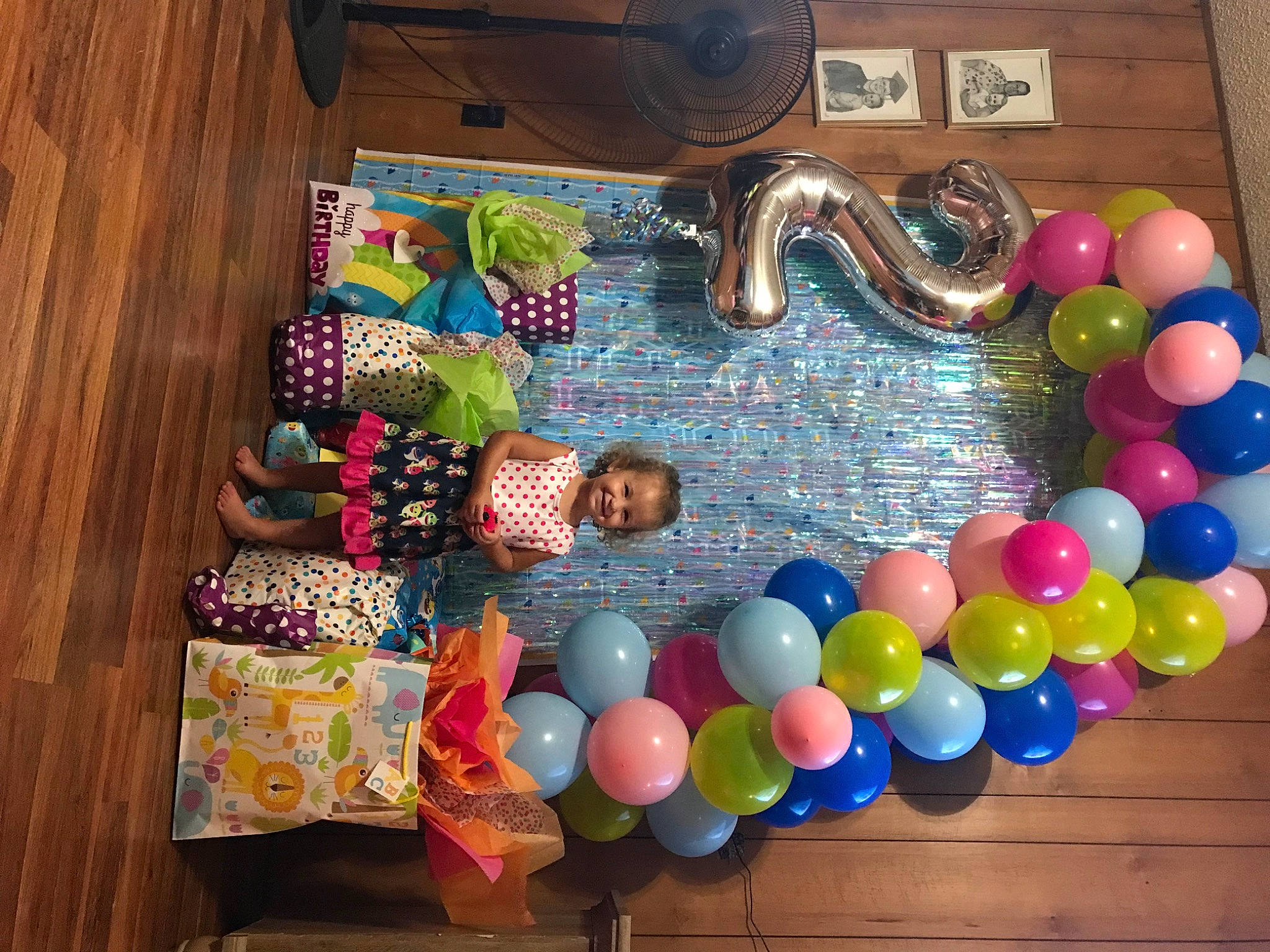 Emerlyn is registered to the contest to win money with this photo: art, balloon, blurred, child, circle, event, fashion_accessory, flooring, hardwood, jewellery, joy, magenta, party_supply, person, play, room, sunglasses, sweetness, table, textile