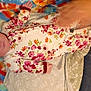 Morgan is registered to the contest to win money with this photo: baby, infant, floral_clothing, headband, blanket, tie_dye, person, sleeping, hand, arm, fabric, colorful, pattern, resting, indoor, casual, comfort, soft, cute, newborn