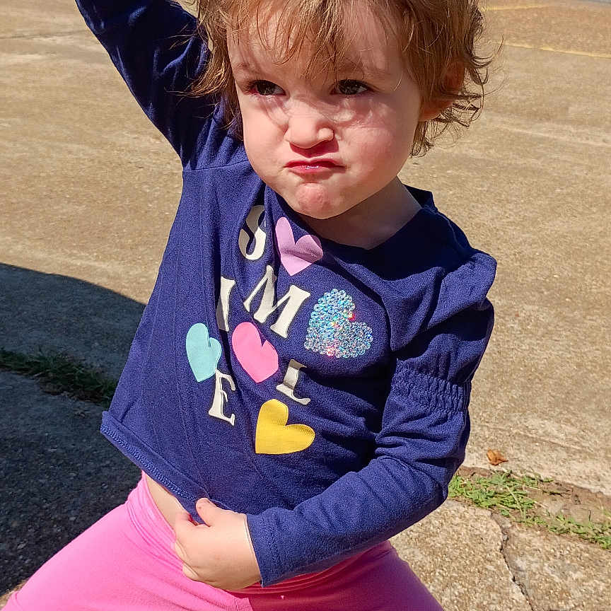 Kayleigh joined the competition — help win amazing prizes! blue_shirt, casual_clothing, child, concrete, confident, daylight, determined, expression, fun, hair, kid, outdoor, person, pink_pants, playful, pose, sneakers, sunny, trees, young