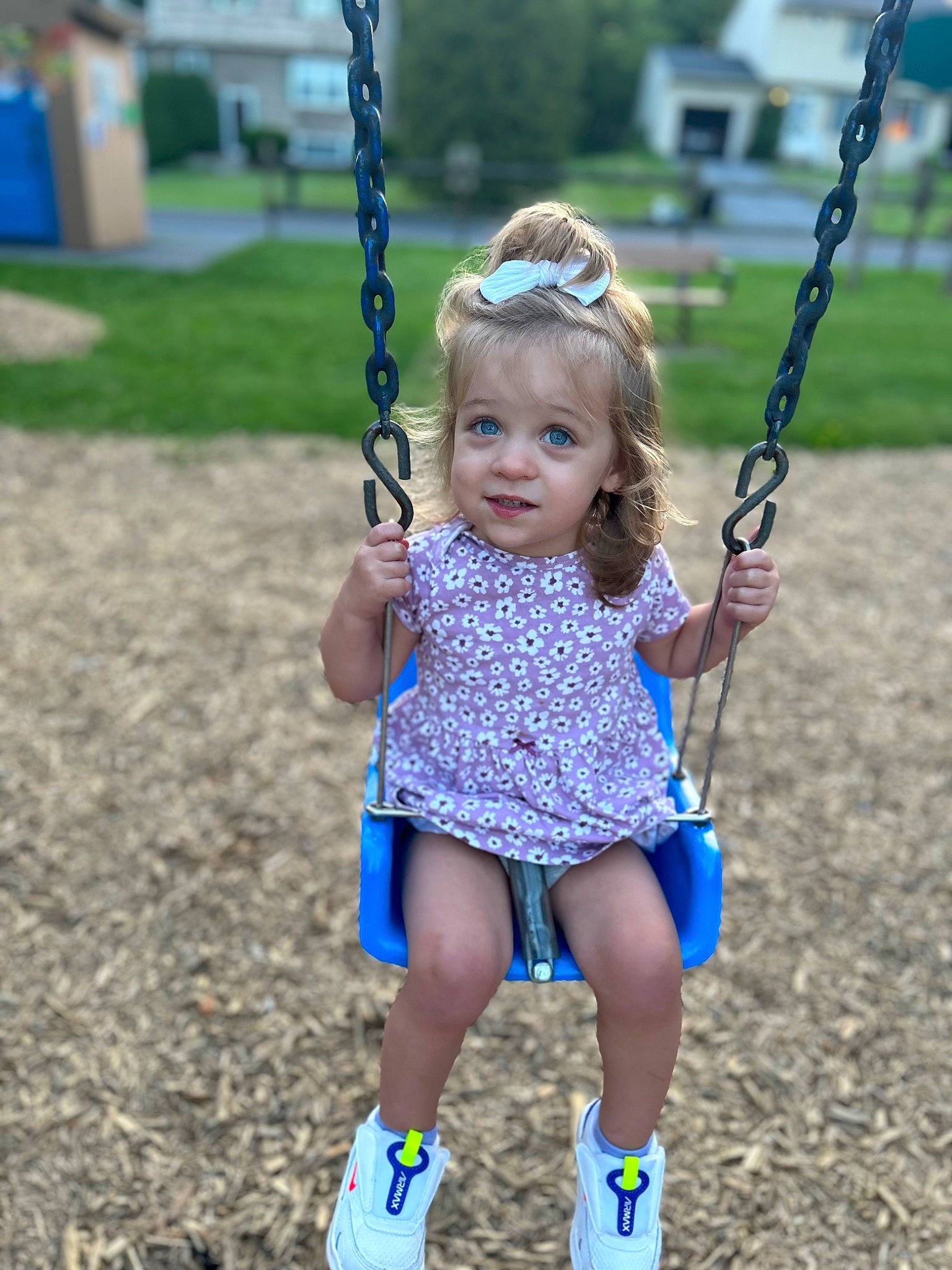 Brynn joined the competition — help win amazing prizes! baby, baby_toddler_clothing, blue, child, electric_blue, fun, grass, hand, happy, leisure, person, plant, playground, recreation, sleeve, smile, summer, swing, toddler, white