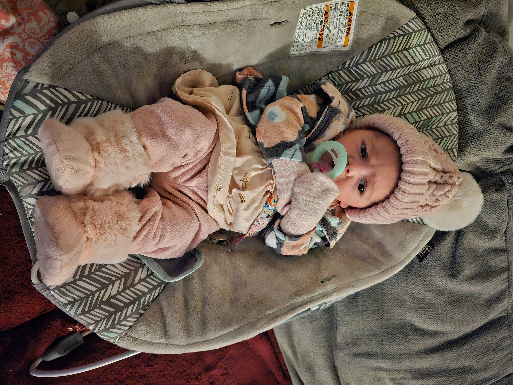 Echo is registered to the contest to win money with this photo: baby, baby_carriage, baby_products, baby_toddler_clothing, child, comfort, dishware, headwear, linens, person, room, sleeve, tableware, toddler, wood