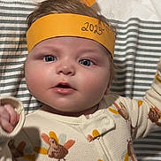 Eric joined the competition — help win amazing prizes! baby, blanket, child, clothing, crown, curious, cute, expression, face, handmade, headwear, indoor, infant, onesie, paper, pattern, portrait, striped, turkey, young