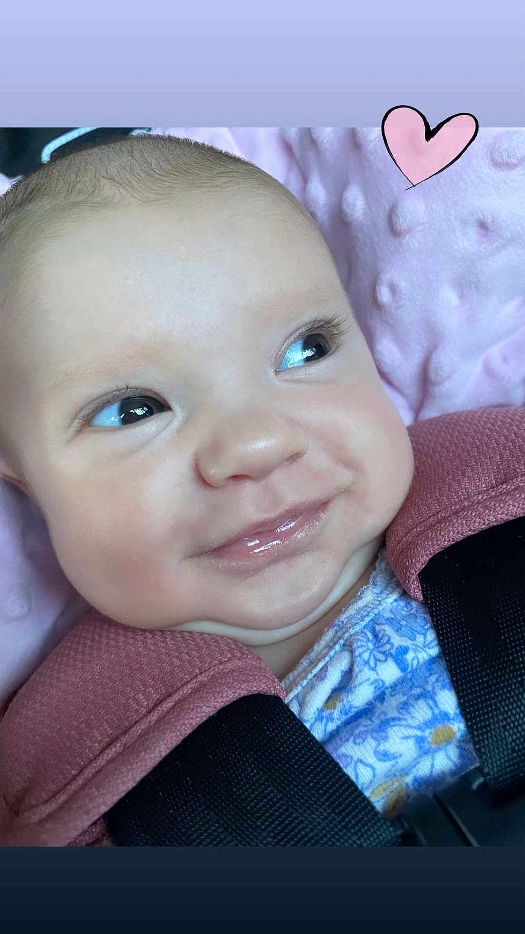 Elena joined the competition — help win amazing prizes! baby, face, smile, close_up, blanket, pink, heart, infant, cute, young_child, portrait, soft_texture, clothing, child, happy, expression, skin, head, seatbelt, car_seat