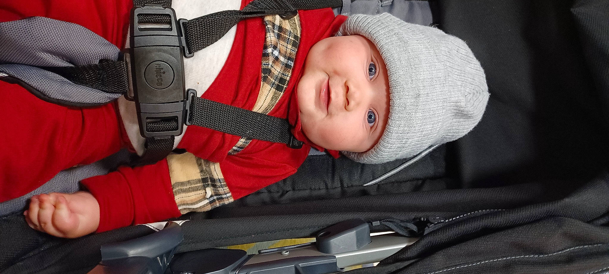 Jakobe joined the competition — help win amazing prizes! auto_part, baby, baby_carriage, baby_products, baby_toddler_clothing, car_seat, child, comfort, cool, headgear, headwear, human_body, mobile_phone, mouth, person, personal_protective_equipment, plaid, product, seat_belt, smile