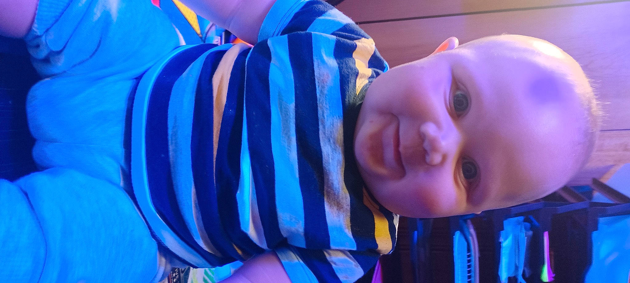 Jakobe is registered to the contest to win money with this photo: azure, baby, baby_toddler_clothing, blue, cheek, clothing, eye, face, hairstyle, happy, headgear, human_body, mouth, nose, organ, person, purple, smile, textile, toddler