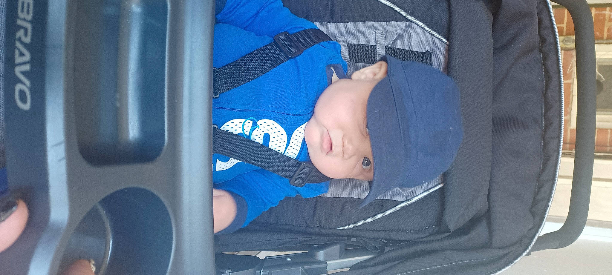 Jakobe joined the competition — help win amazing prizes! auto_part, automotive_design, automotive_exterior, automotive_wheel_system, baby, baby_carriage, baby_in_car_seat, baby_products, baby_toddler_clothing, baseball_cap, car_seat, child, comfort, electric_blue, fun, hat, headwear, person, sitting, t_shirt