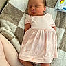newborn, baby, sleeping, infant, pink_dress, dress, blanket, cozy, portrait, indoors, lying_down, peaceful, closed_eyes, face, feet, legs, textile, cushion, home, photography