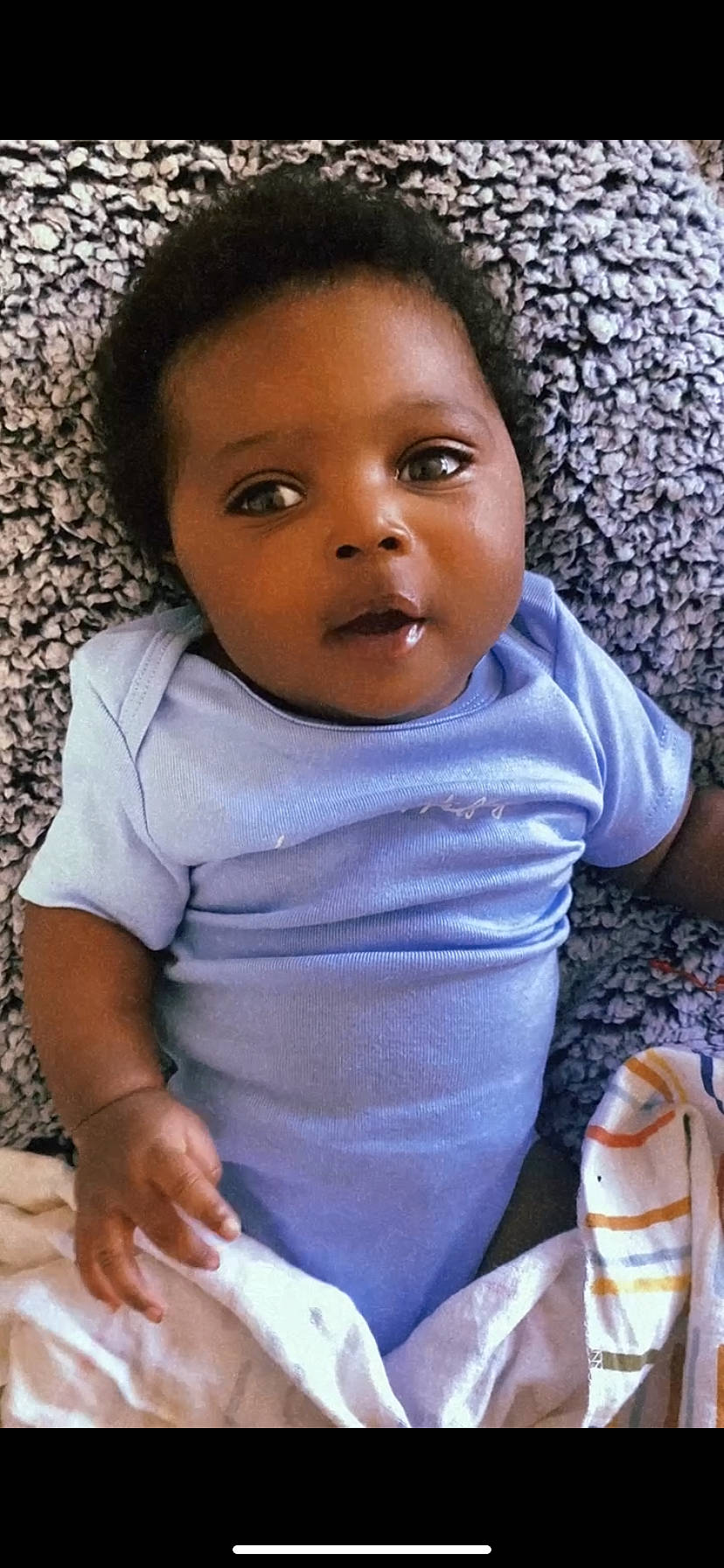Jeremiah joined the competition — help win amazing prizes! baby_toddler_clothing, cheek, chin, eye, face, facial_expression, finger, gesture, hairstyle, happy, head, human_body, iris, lip, mouth, nose, organ, person, skin, sleeve