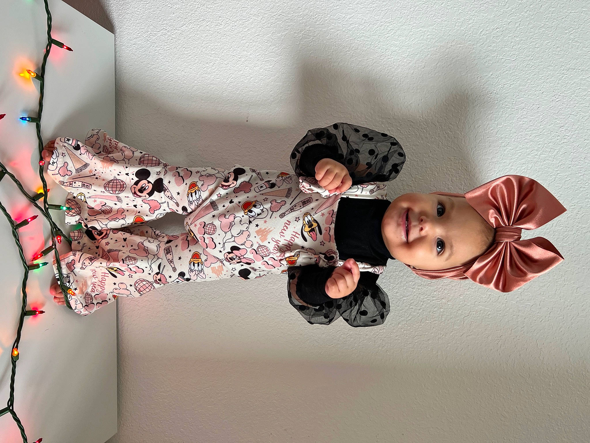 Esmeralda is registered to the contest to win money with this photo: baby, baby_toddler_clothing, carmine, child, comfort, fashion_accessory, fashion_design, fun, joy, linens, magenta, pattern, person, pink, room, sitting, sleeve, textile, toddler, tree