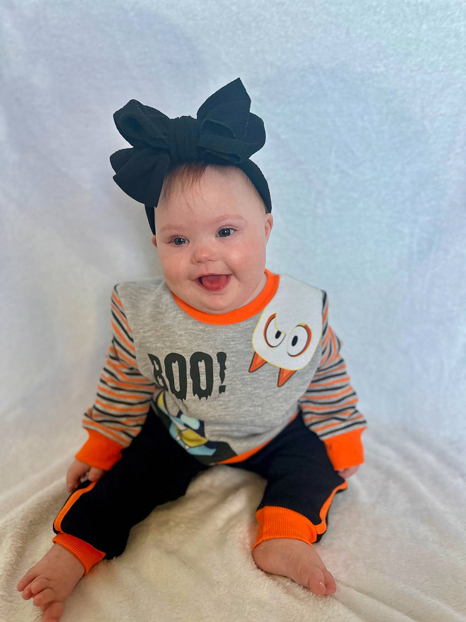 Evangeline is registered to the contest to win money with this photo: baby, baby_toddler_clothing, cap, child, clothing, costume_hat, face, fun, happy, hat, head, orange, pattern, person, sitting, sleeve, smile, sportswear, t_shirt, toddler