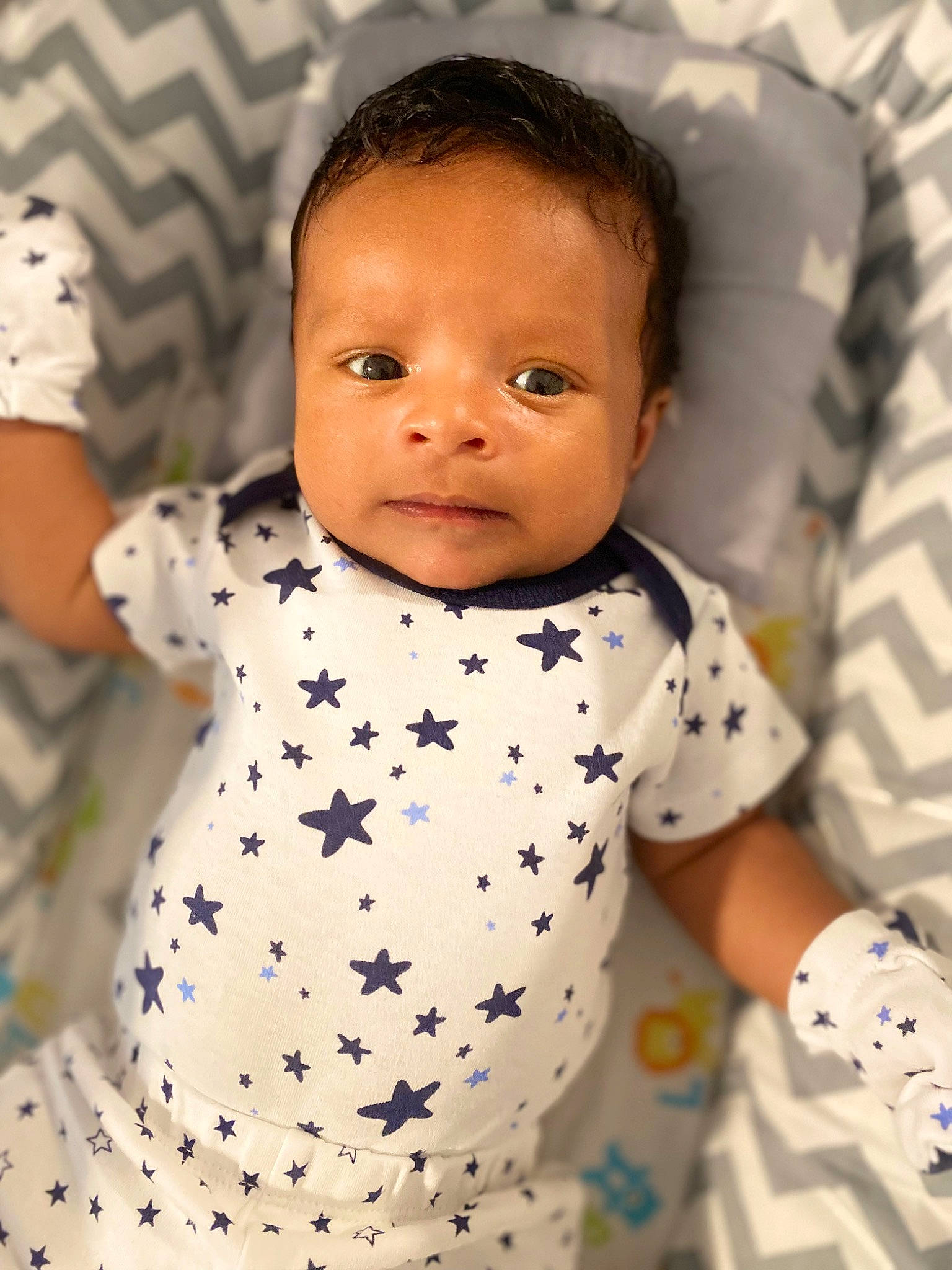 Jayden is registered to the contest to win money with this photo: baby, baby_products, baby_toddler_clothing, cheek, child, collar, comfort, eyelash, face, facial_expression, happy, head, linens, nose, pattern, person, product, skin, sleeve, toddler